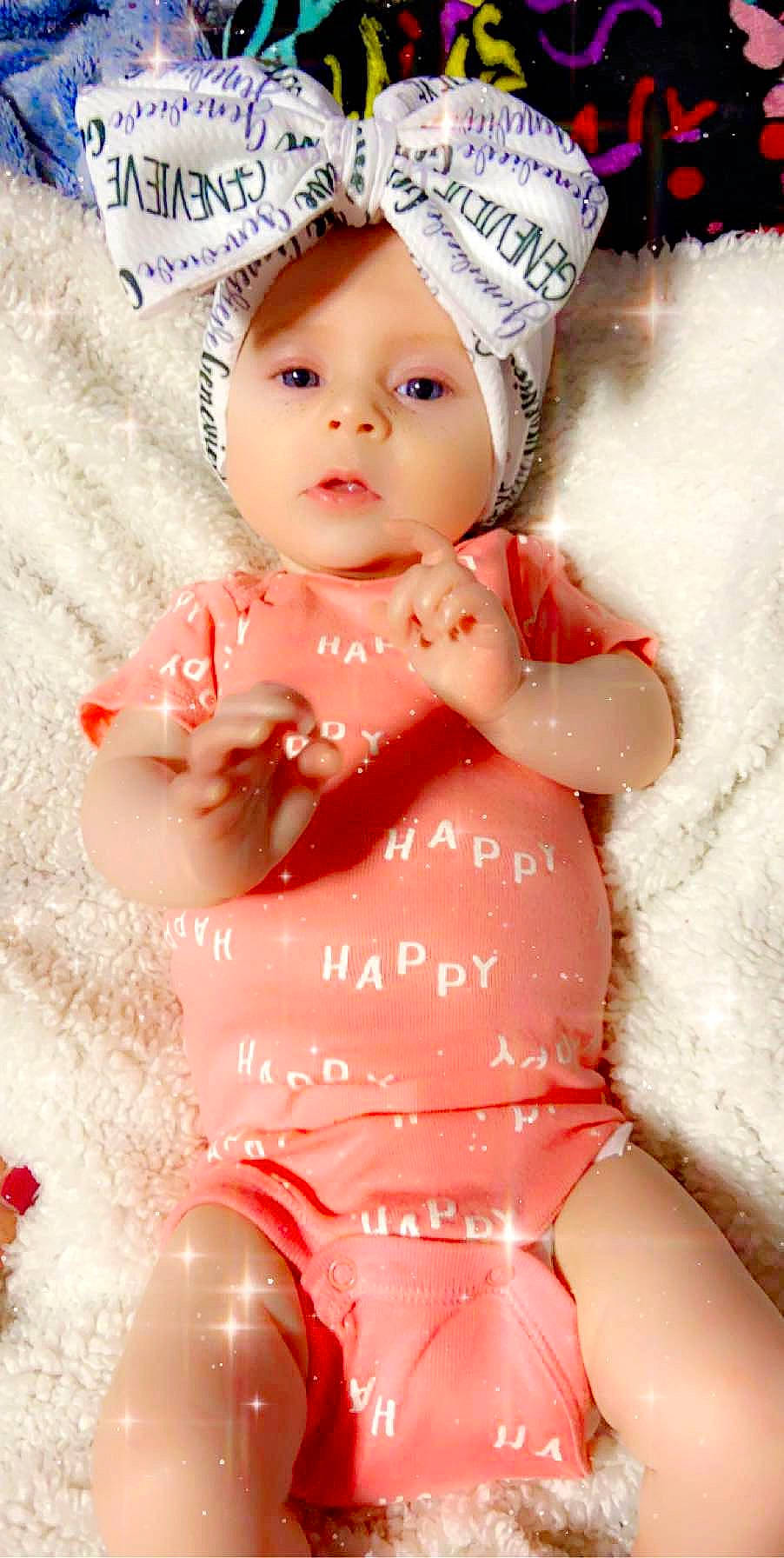 Genevieve joined the competition — help win amazing prizes! baby, baby_toddler_clothing, cheek, child, doll, headgear, headwear, person, pink, toddler