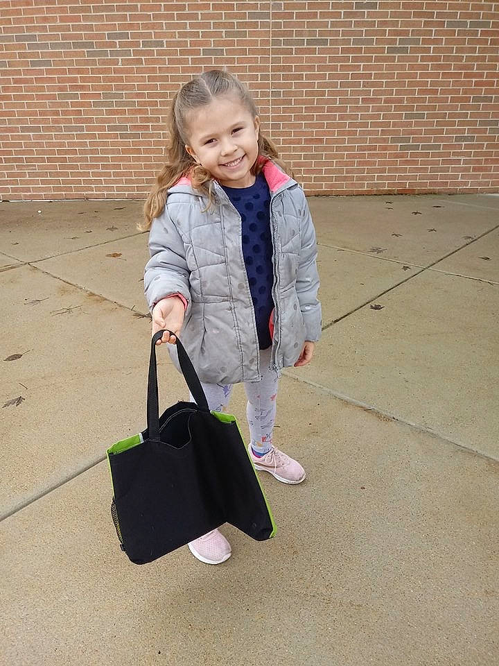Peighton is registered to the contest to win money with this photo: bag, blazer, child, diaper_bag, hand_luggage, jacket, joy, luggage_and_bags, material_property, outerwear, person, satchel, shoe, shoulder, snapshot, toddler