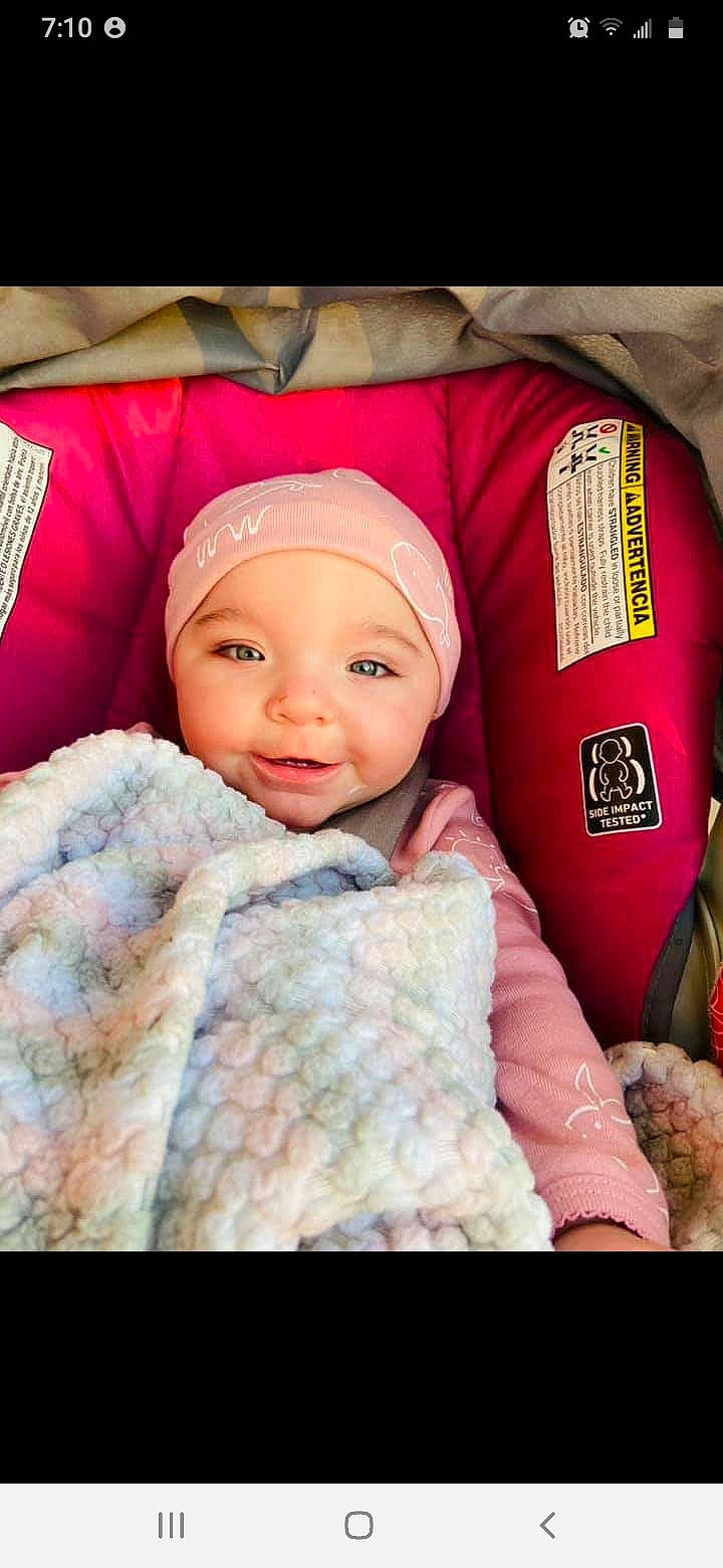 Lilianna is registered to the contest to win money with this photo: baby, baby_products, baby_sleeping, baby_toddler_clothing, beanie, blanket, bonnet, cheek, child, comfort, eyebrow, headgear, headwear, knit_cap, linens, person, pink, skin, textile, toddler