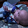 Maverick is registered to the contest to win money with this photo: animal_print, baby, bedtime, blanket, bottle, child, clothing, cozy, cute, face, feeding, hand, indoor, infant, lying_down, newborn, nursery, portrait, sleep, sleepwear