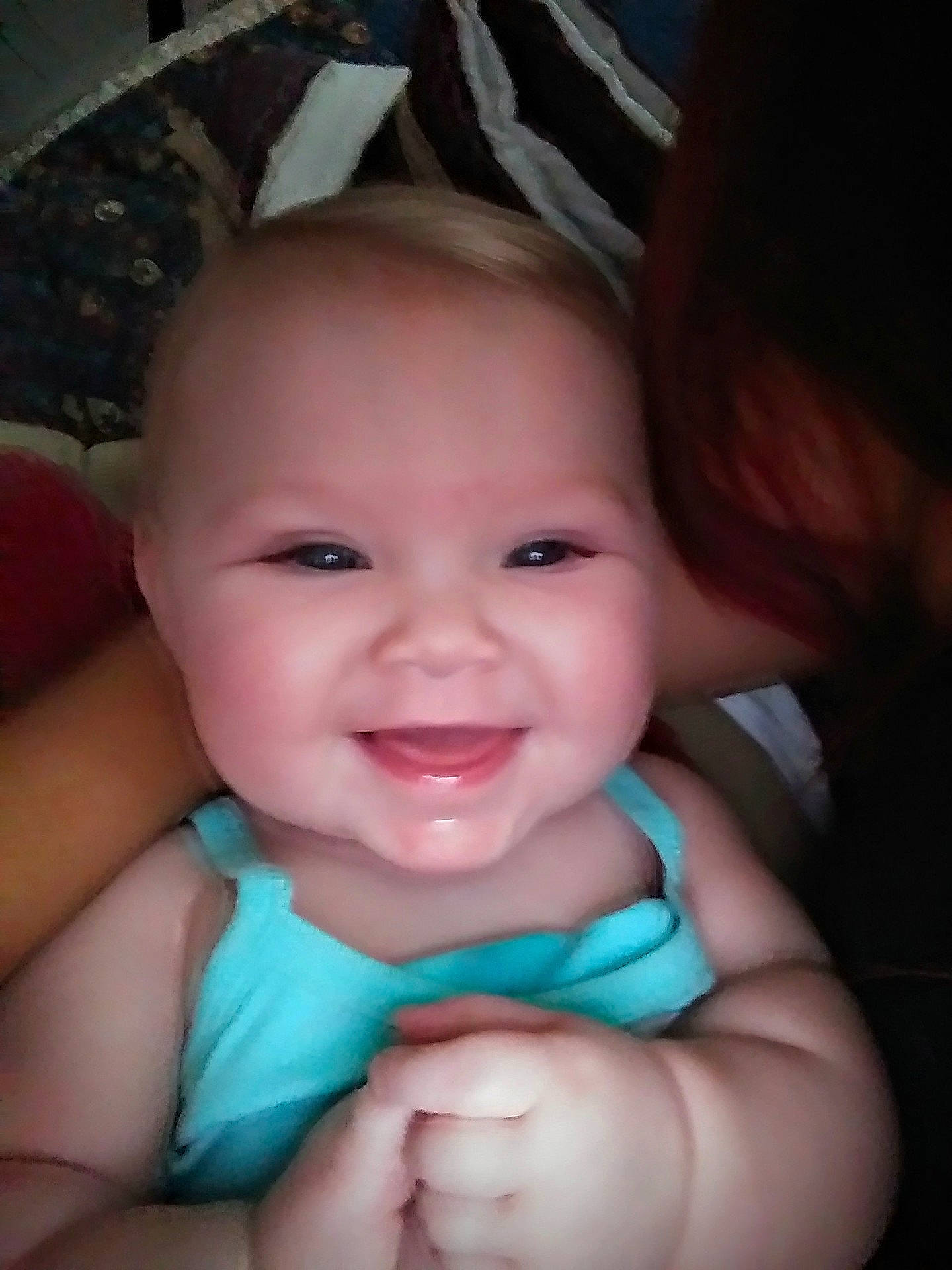 Sadie is registered to the contest to win money with this photo: cheek, child, chin, emotion, eye, eyebrow, face, facial_expression, finger, forehead, girl, head, human_hair_color, infant, joy, lip, mouth, nose, person, skin