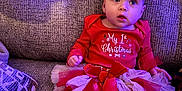 Oaklee joined the competition — help win amazing prizes! baby, infant, festive_clothing, christmas, red, white, tutu, bow, headband, striped_leggings, couch, seated, indoors, cute, holiday, portrait, child, soft_light, cozy, expression