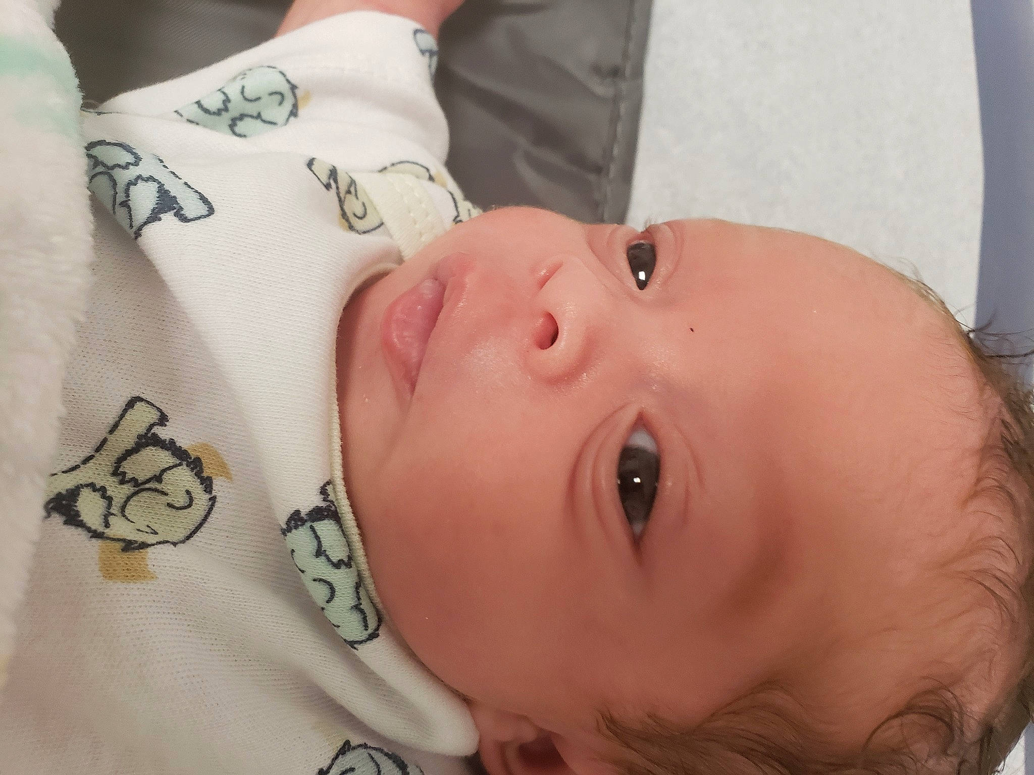 Joziah is registered to the contest to win money with this photo: baby, baby_toddler_clothing, cheek, child, ear, eyebrow, eyelash, human_body, lip, mouth, neck, nose, pattern, person, product, skin, sleeve, textile, throat, toddler