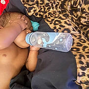 Iyanna is registered to the contest to win money with this photo: baby, bed, blanket, bottle, child, comfort, cozy, cute, feeding, hand, infant, leopard_print, lying_down, nursery, resting, skin, sleeping, sleepwear, toddler, young_child
