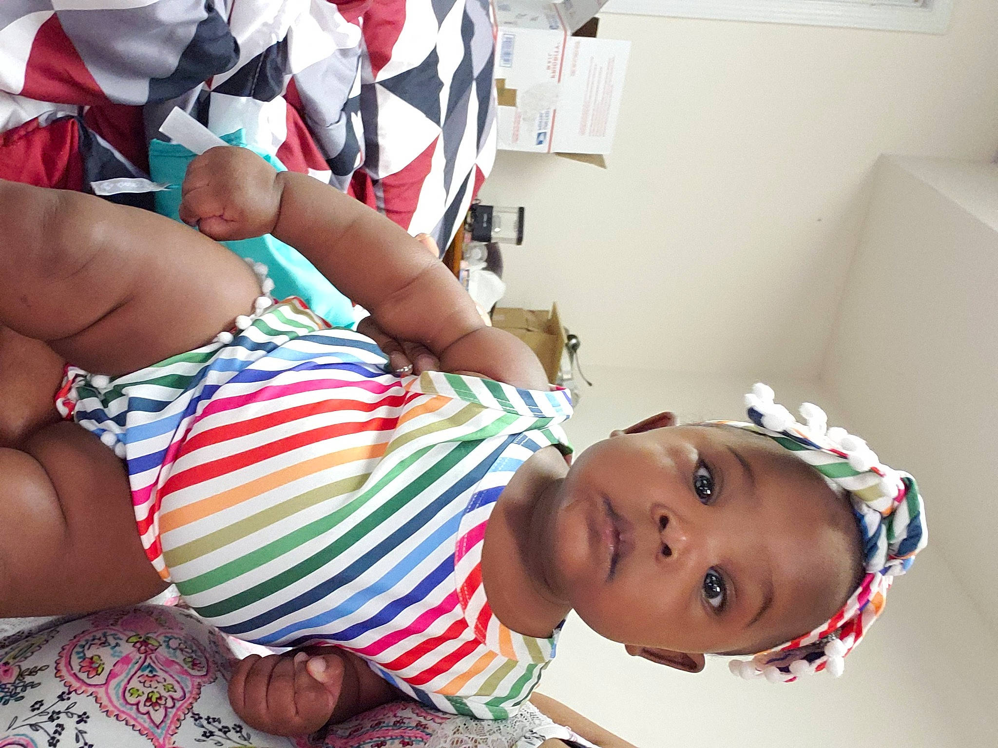 Novah is registered to the contest to win money with this photo: abdomen, baby, chest, child, elbow, eyewear, foot, fun, happy, human_leg, leisure, pattern, person, play, room, selfie, thigh, toddler, trunk, undergarment