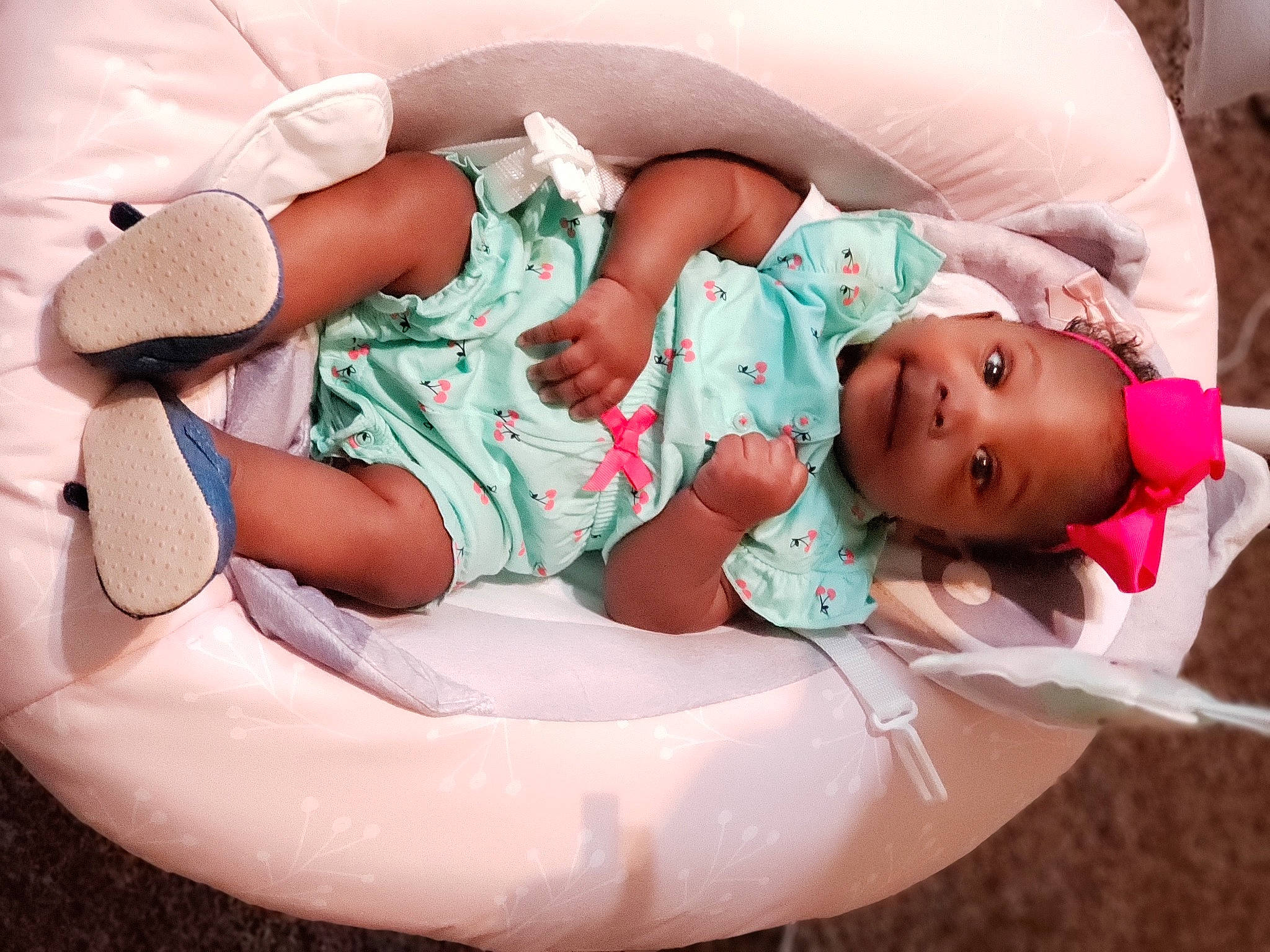 Novah joined the competition — help win amazing prizes! baby, baby_products, baby_sleeping, baby_toddler_clothing, child, comfort, event, facial_expression, foot, happy, human_body, human_leg, leg, mouth, person, pink, sitting, skin, sock, thigh