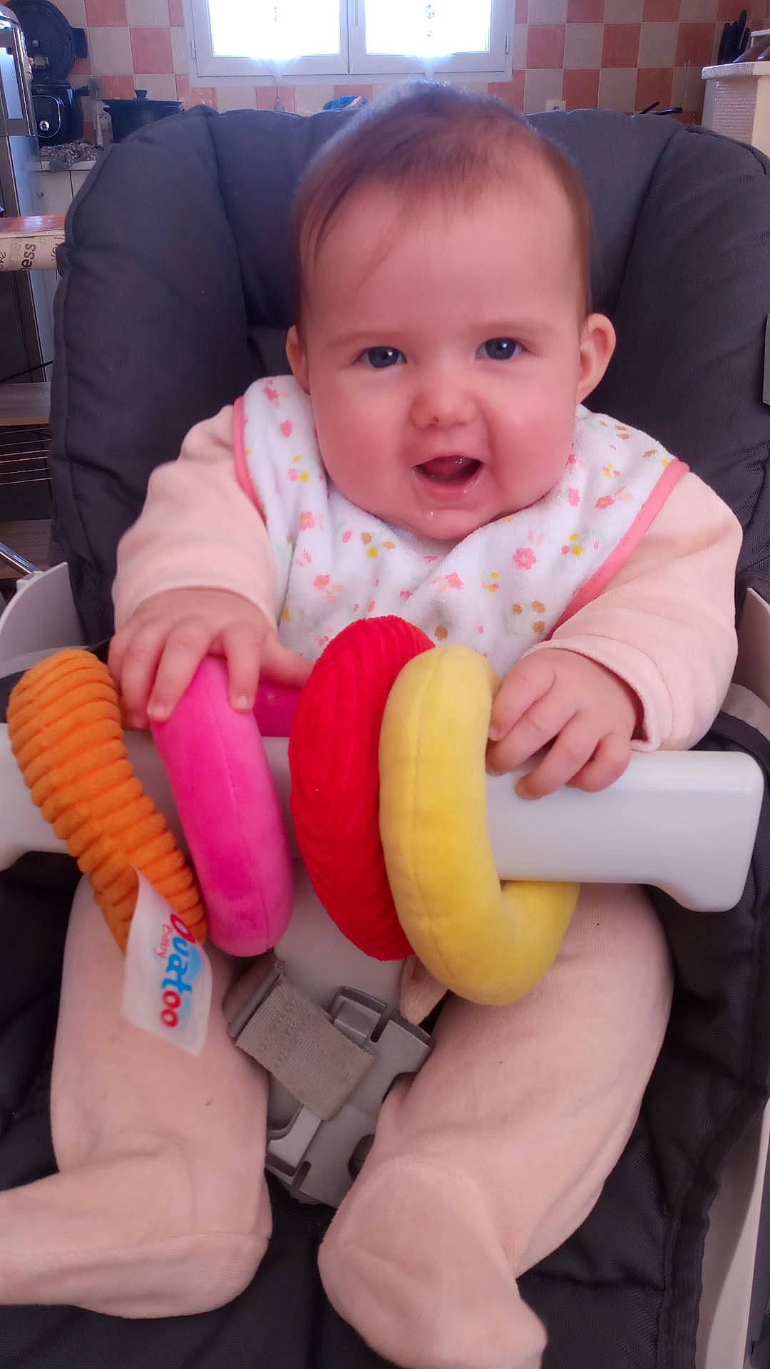 Ashley participe au concours pour gagner de l'argent avec cette photo : arm, baby, baby_toddler_clothing, cheek, comfort, facial_expression, finger, gesture, hand, happy, human_body, joy, mouth, nose, person, pink, skin, sleeve, smile, textile