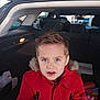 Wyatt a rejoint le concours — aidez-le/la à gagner de superbes lots ! blue_eyes, boy, car_trunk, casual, child, closeup, curious_expression, daytime, fur_hood, hatchback, interior, light_fixture, looking_at_camera, parking_lot, portrait, red_coat, sitting, spiky_hair, toy_items, winter_jacket