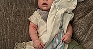 Jackson is registered to the contest to win money with this photo: baby, sleeping, blanket, pacifier, couch, infant, child, comfort, clothing, relaxation, soft, peaceful, indoor, person, rest, toddler, cute, nap, young, home
