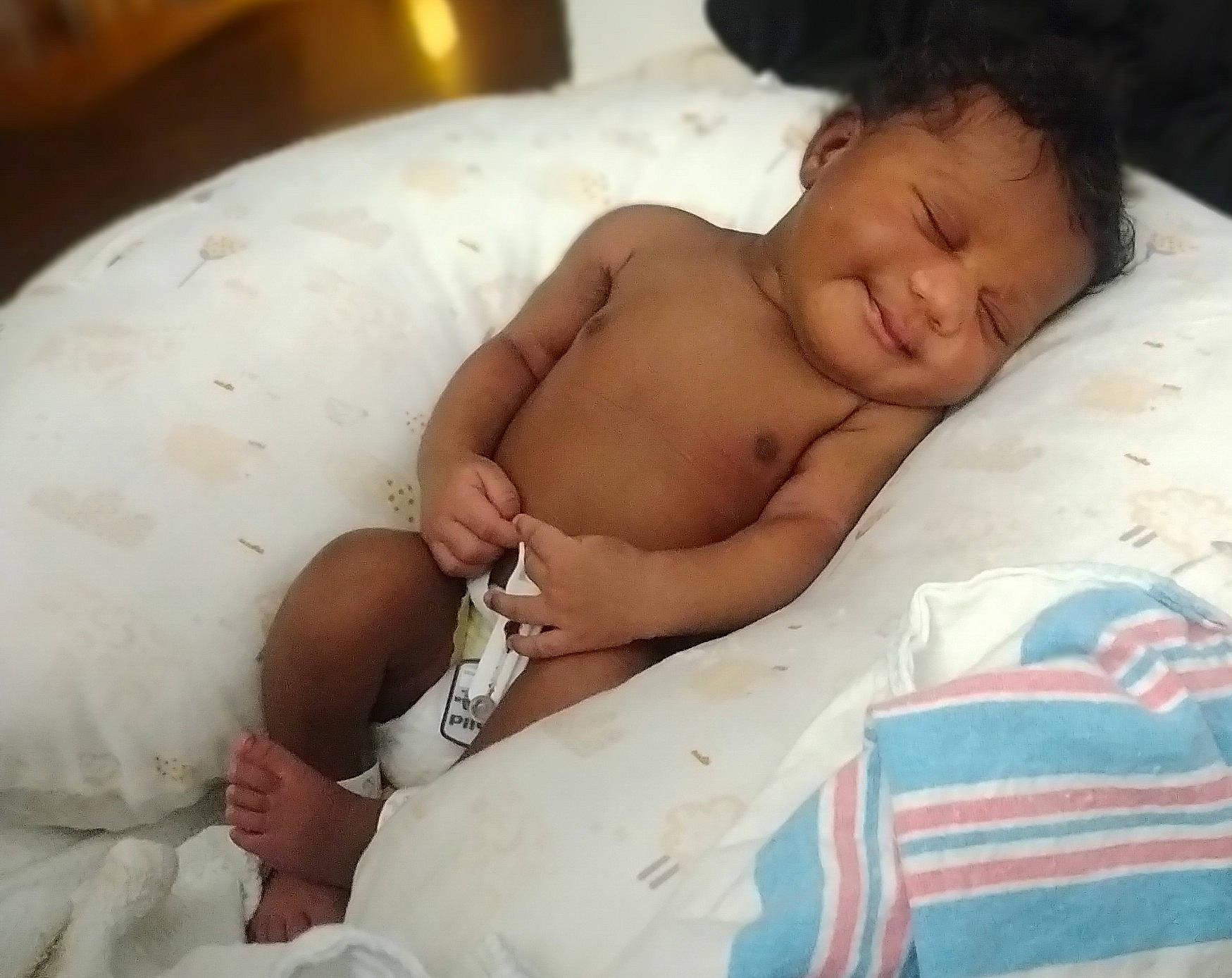 Alayah joined the competition — help win amazing prizes! abdomen, baby, baby_products, bathing, bedding, bedtime, chest, child, comfort, diaper, event, face, flesh, human_body, linens, person, skin, stomach, thumb, toddler