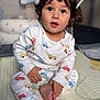 Octavio joined the competition — help win amazing prizes! toddler, child, baby, onesie, play_mat, toy, indoor, curly_hair, sitting, bare_feet, expression, cute, young_child, clothing, person, face, hand, foot, room, soft_lighting