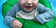 Elieys joined the competition — help win amazing prizes! toddler, child, smiling, happy, wet_hair, inflatable_ring, pool, water, blue, green, splash, summer, outdoor, playing, cute, face, person, fun, clothing, baby