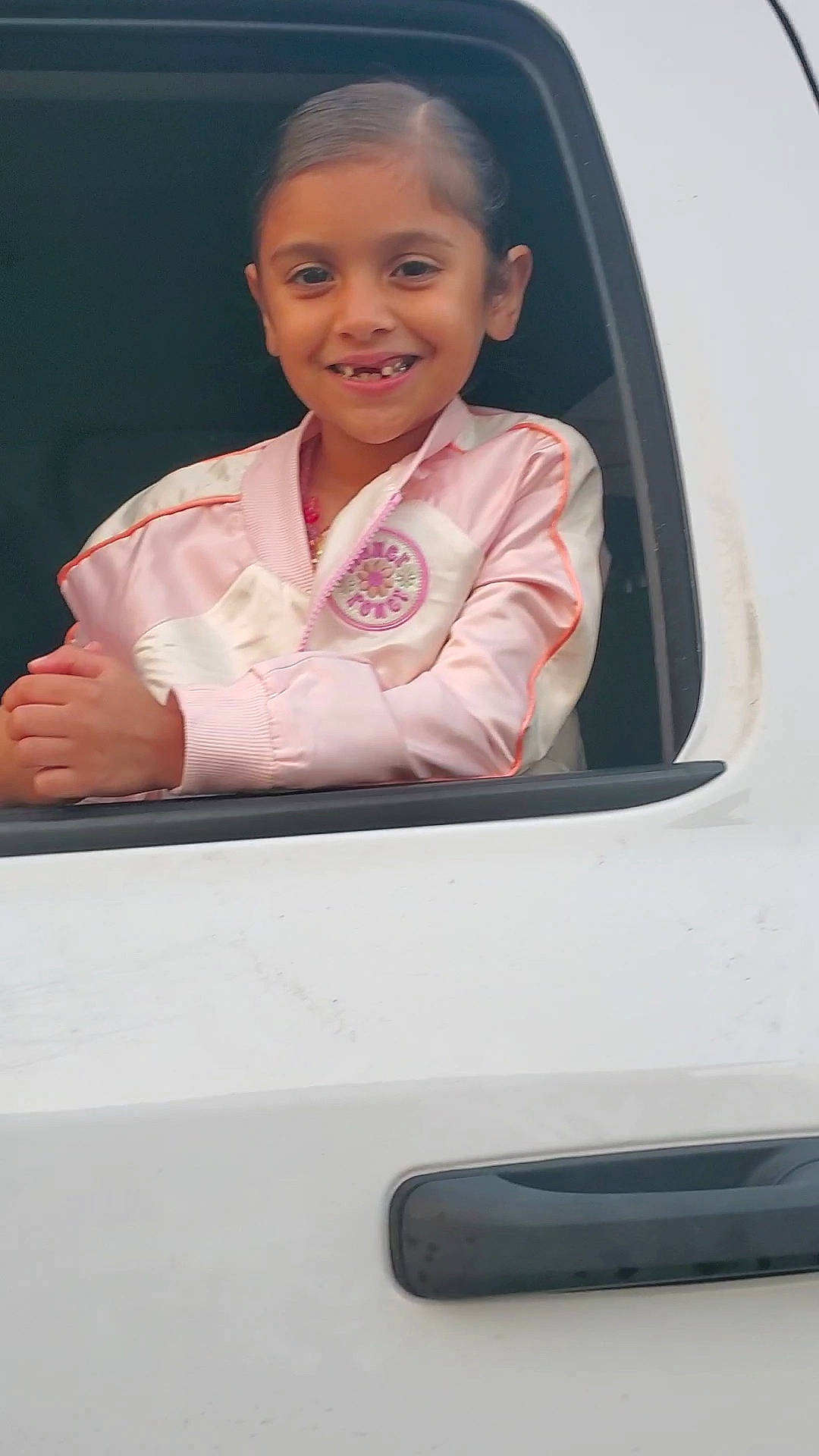 Emrey is registered to the contest to win money with this photo: auto_part, automotive_exterior, baby, child, family_car, flash_photography, fun, gadget, gesture, happy, joy, magenta, person, photograph, sitting, sleeve, smile, t_shirt, technology, toddler