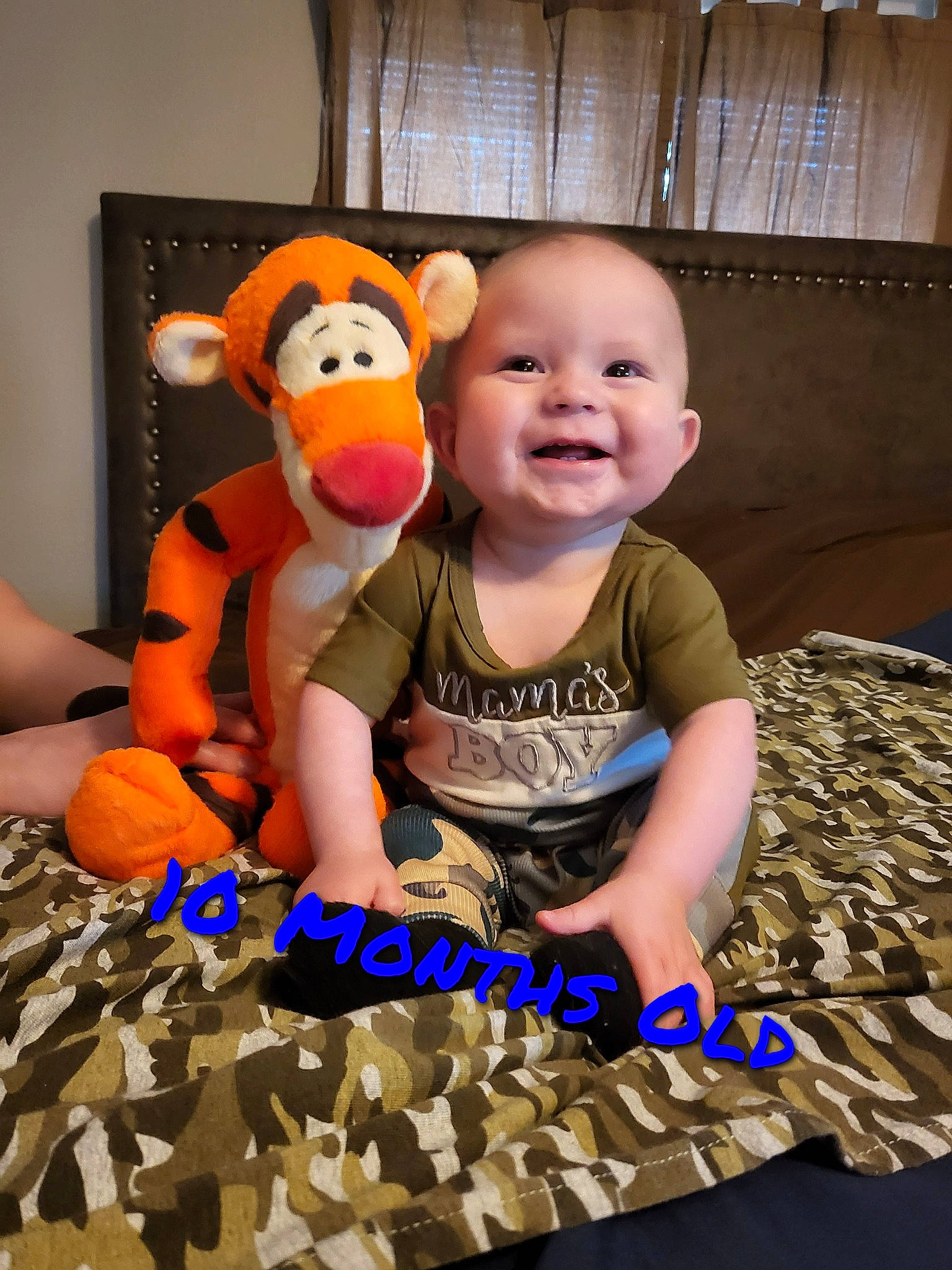 Ryder joined the competition — help win amazing prizes! baby, baby_toddler_clothing, baby_toys, child, facial_expression, finger, flooring, fun, happy, mammal, orange, person, room, sitting, smile, snapshot, stuffed_toy, t_shirt, toddler, toy
