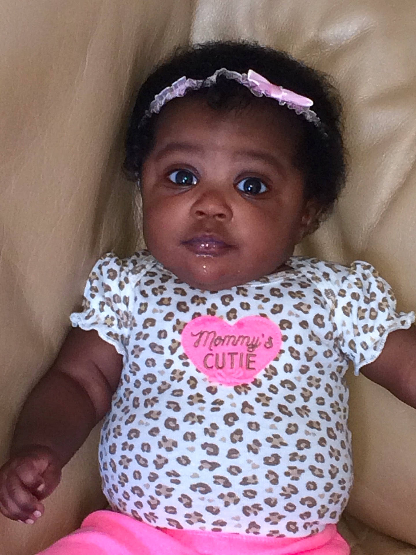 Summer is registered to the contest to win money with this photo: baby_products, cheek, child, day, eye, face, girl, hair_accessory, happiness, head, headgear, infant, nose, pattern, person, pink, product, skin, smile, textile