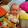 Lucus joined the competition — help win amazing prizes! baby, infant, child, onesie, cushion, pillow, bed, blanket, indoor, face, hand, expression, soft_toys, patterned_clothing, newborn, person, comfort, cozy, cute, smile