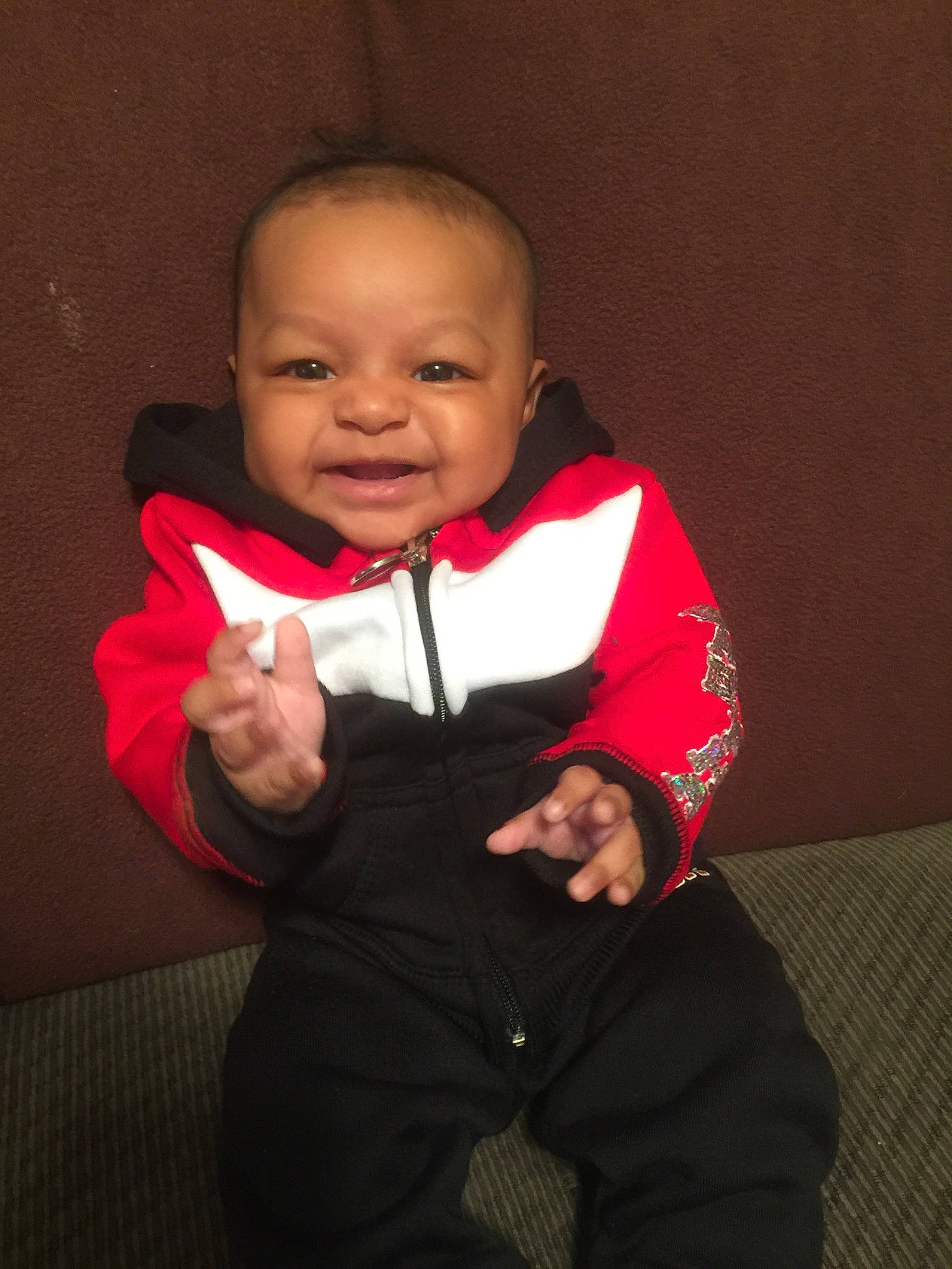 Quinn joined the competition — help win amazing prizes! baby, cheek, child, face, facial_expression, finger, formal_wear, fun, happy, head, hoodie, outerwear, person, pink, red, skin, smile, toddler