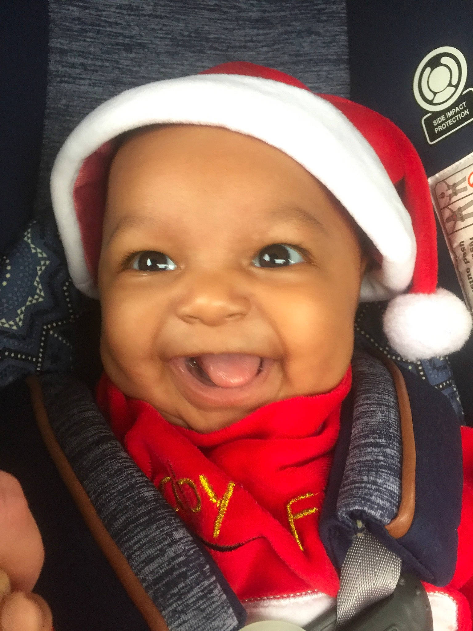 Quinn is registered to the contest to win money with this photo: cheek, child, chin, cool, eye, eyebrow, face, facial_expression, fun, happy, head, headgear, headwear, joy, lip, mouth, nose, organ, person, red