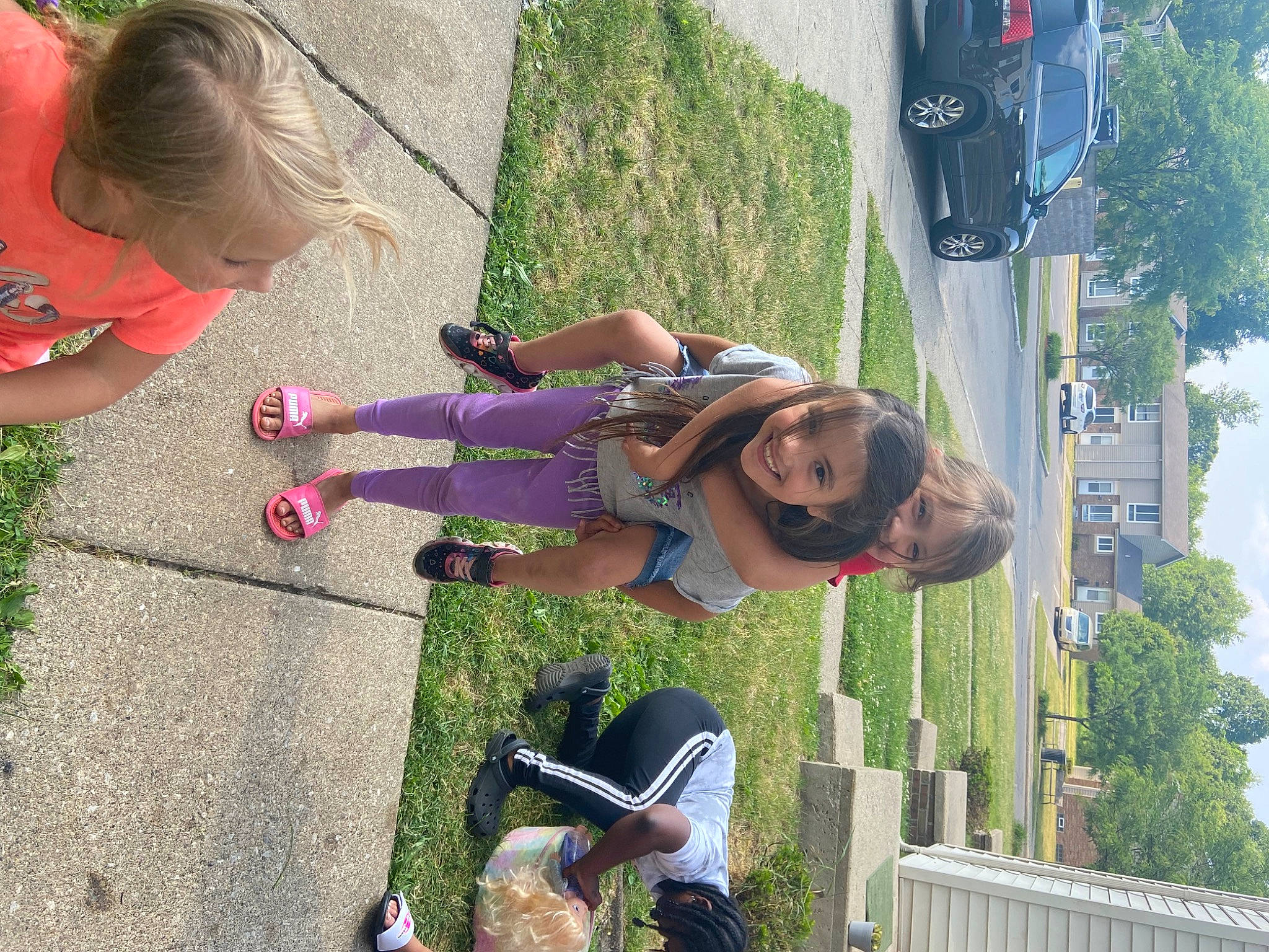 Kendra joined the competition — help win amazing prizes! car, child, city, family_car, fun, grass, green, human_settlement, joy, leisure, person, photography, plant, public_space, recreation, sidewalk, sky, snapshot, toddler, tree