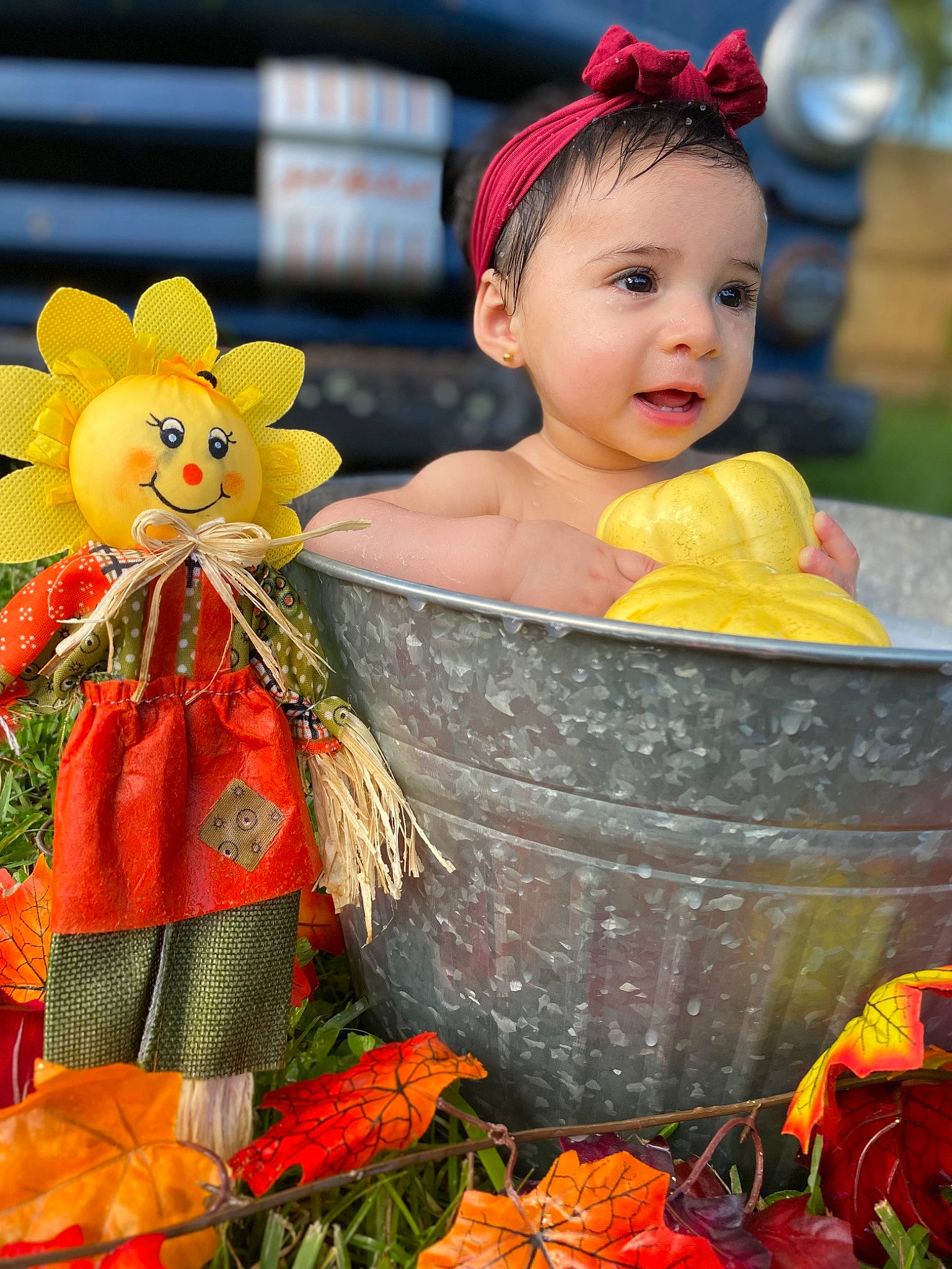 Gabriella is registered to the contest to win money with this photo: baby, baby_toddler_clothing, basket, cap, child, doll, event, fun, happy, headgear, jewellery, natural_foods, orange, person, plant, product, red, snapshot, toddler, toy