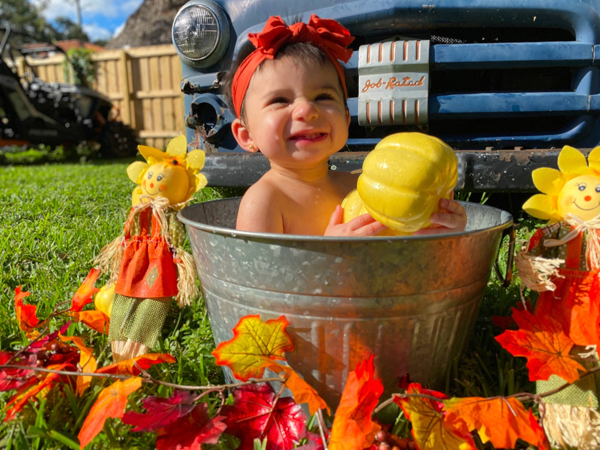 Gabriella is registered to the contest to win money with this photo: baby, child, flower, flowerpot, fun, garden, grass, happy, hat, headwear, joy, leisure, natural_foods, orange, person, plant, recreation, red, smile, spring