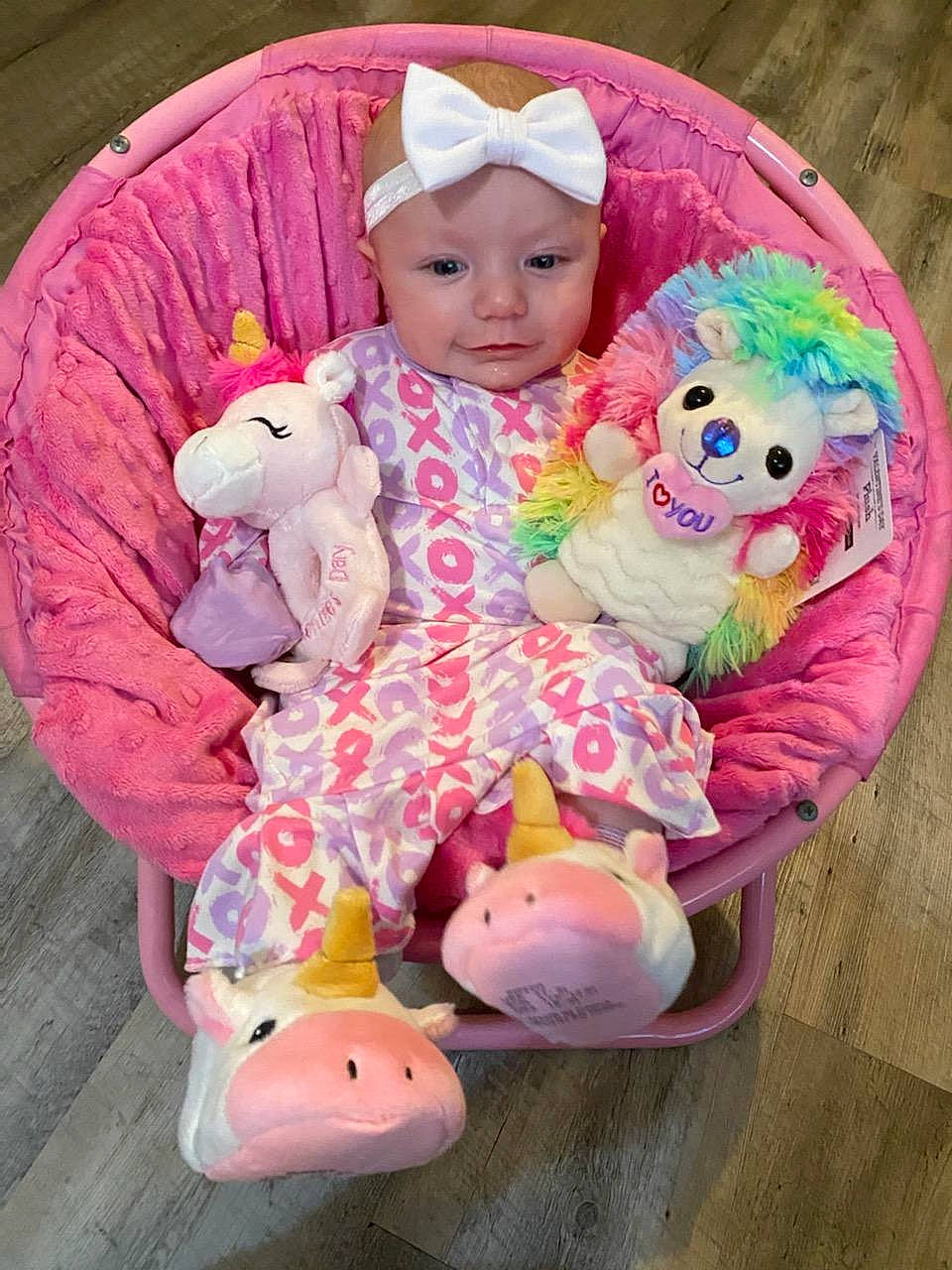 Kenley is registered to the contest to win money with this photo: arm, baby, baby_toddler_clothing, cheek, clothing, dress, eye, happy, head, headgear, headwear, human_body, magenta, mammal, person, pink, purple, skin, sleeve, toddler