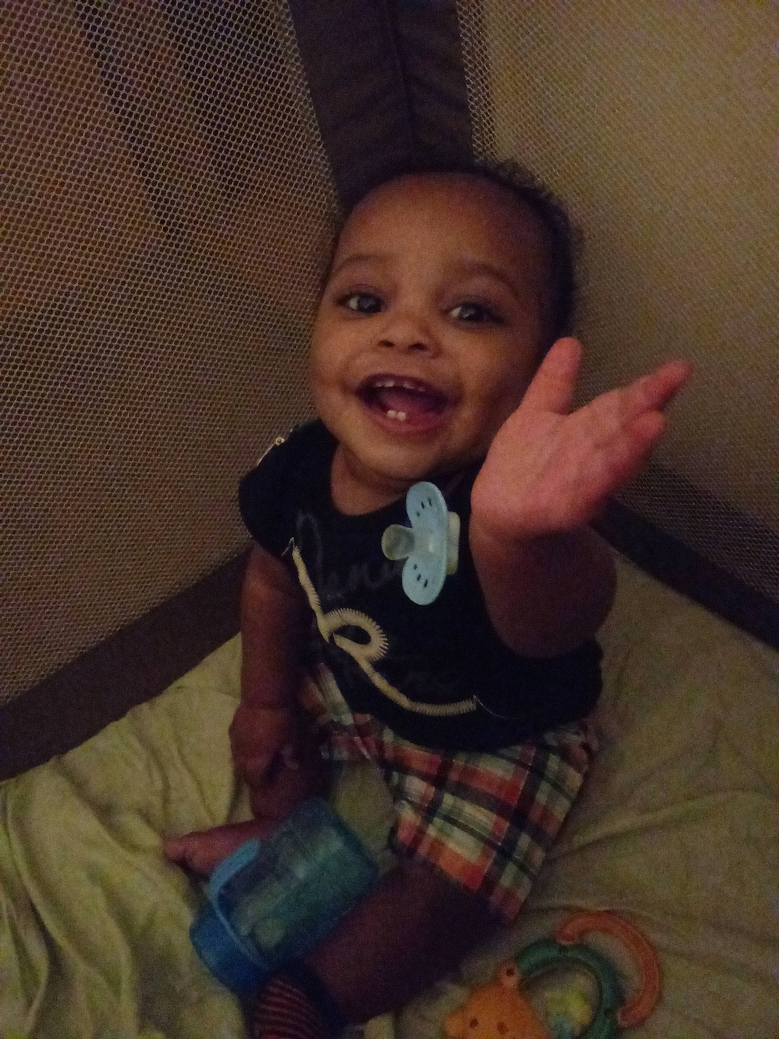 Jay'Veon is registered to the contest to win money with this photo: arm, cheek, child, cool, day, eye, finger, forehead, girl, head, infant, mouth, nose, person, plaid, product, sitting, skin, smile, toddler