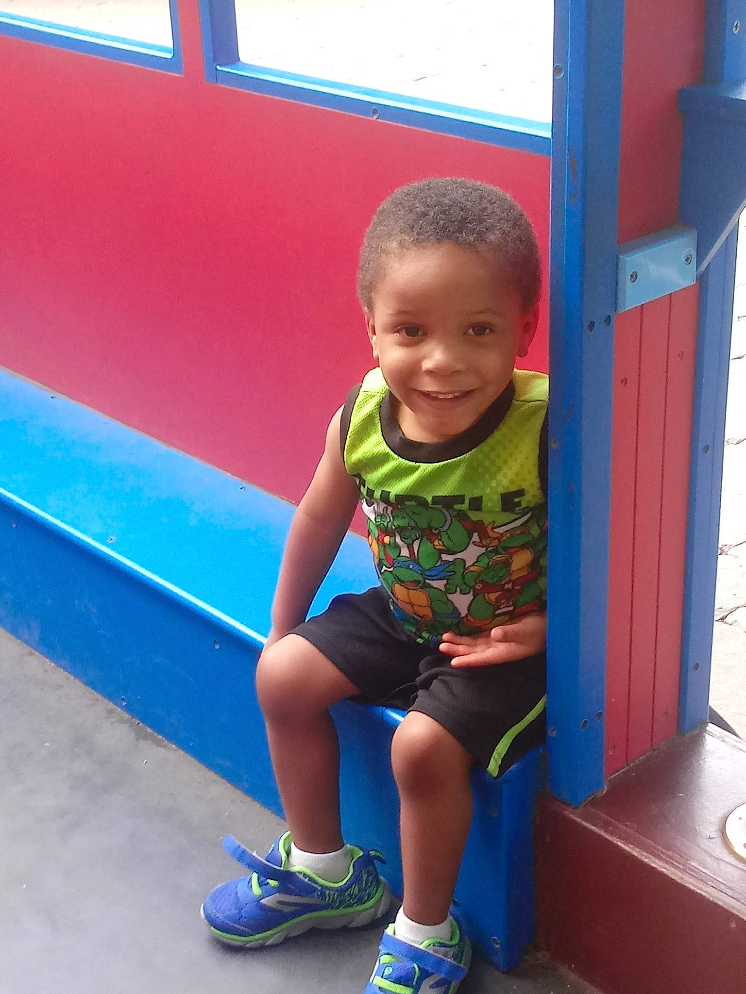 Jayceon joined the competition — help win amazing prizes! blue, boy, child, cool, day, fun, infant, joy, leisure, outdoor_play_equipment, person, play, playground, product, recreation, red, sitting, smile, standing, t_shirt