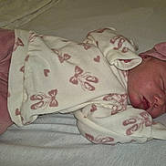 Emma-Leigh joined the competition — help win amazing prizes! baby, newborn, sleeping, pink_clothing, headband, bow, infant, soft_fabric, bed, blanket, peaceful, child, cute, resting, sleep, portrait, indoors, cozy, small, human