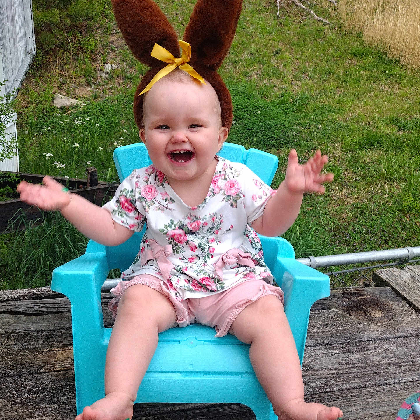 Sara-lynn is registered to the contest to win money with this photo: baby, backyard, chair, clothing, dress, face, furniture, grass, happy, head, nature, outdoors, person, photography, plant, portrait, shorts, sitting, summer, yard
