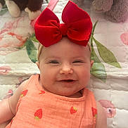 Brinley joined the competition — help win amazing prizes! baby, blanket, chubby_cheeks, closeup, cute, eyes_open, floral_pattern, happy, headband, indoor, infant, pink_dress, plush_toy, portrait, quilt, red_bow, rosy_cheeks, smile, strawberry_print, stuffed_animal