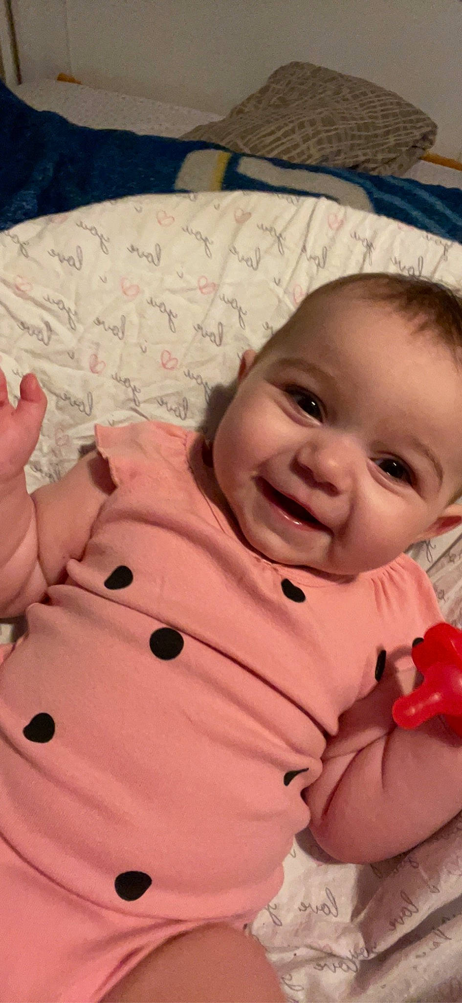 Chelsea is registered to the contest to win money with this photo: baby, baby_toddler_clothing, cheek, comfort, eye, face, finger, gesture, happy, head, human_body, iris, lip, mouth, nose, person, pink, skin, sleeve, smile