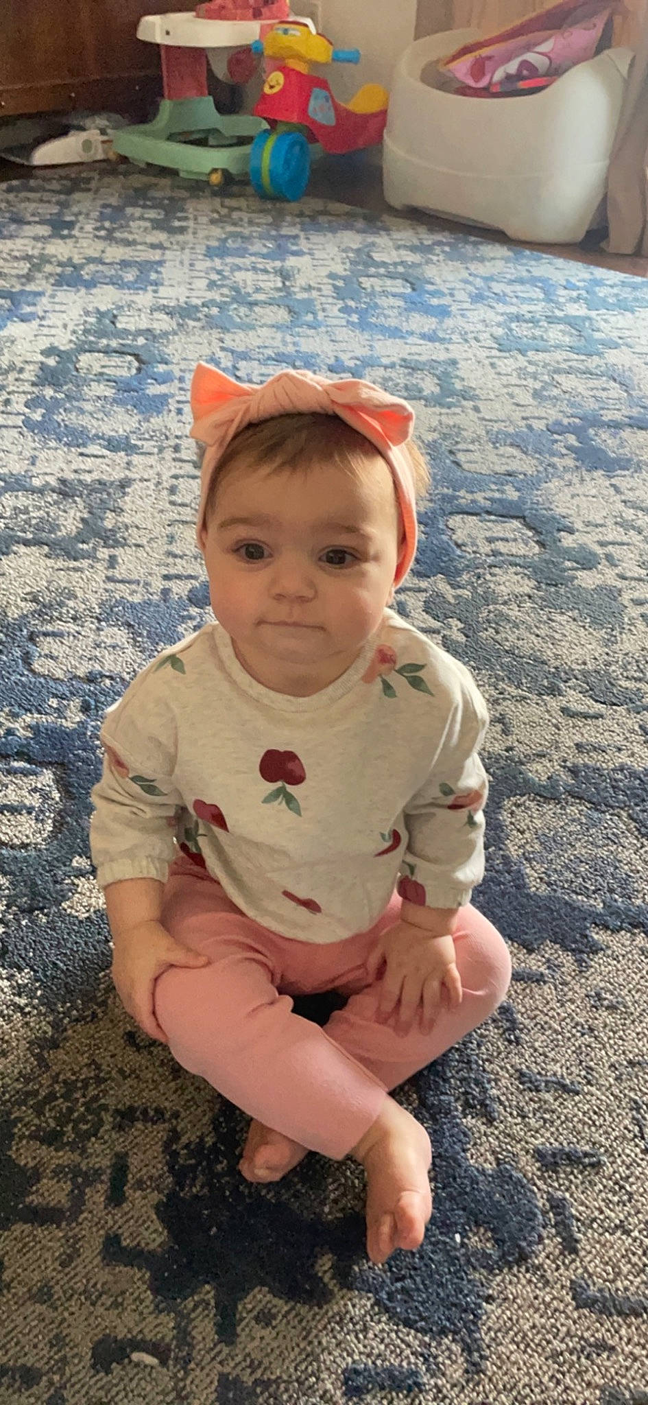 Chelsea joined the competition — help win amazing prizes! baby, baby_toddler_clothing, cheek, child, eye, face, flooring, foot, fun, grass, happy, head, human_leg, knee, pattern, person, sitting, sleeve, soil, thigh