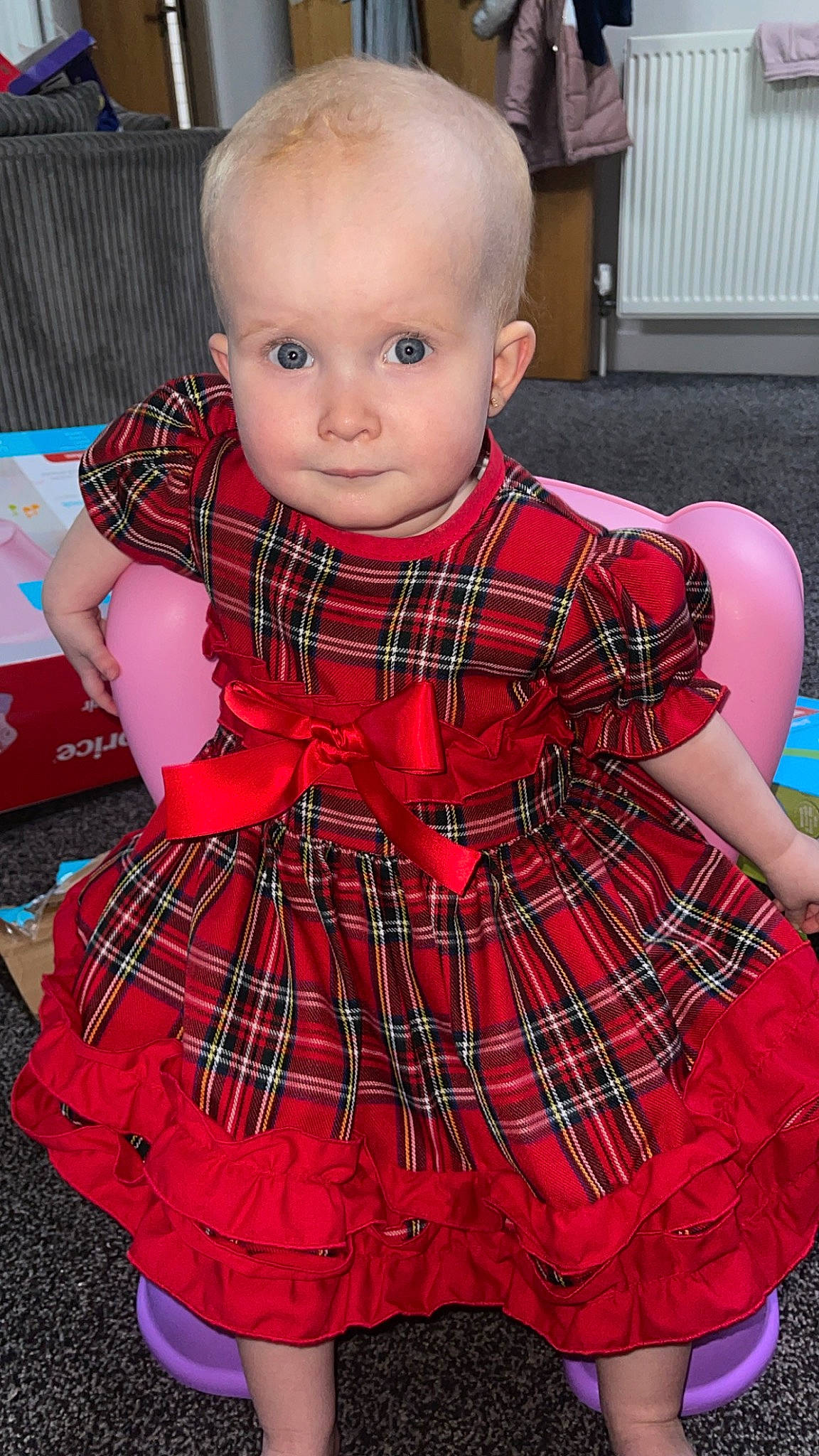 Darcie joined the competition — help win amazing prizes! baby, baby_toddler_clothing, black, child, collar, day_dress, dress, fashion, magenta, one_piece_garment, pattern, person, plaid, red, sitting, sleeve, tartan, textile, toddler, white