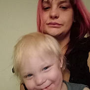 O'Rion is registered to the contest to win money with this photo: child, adult, woman, toddler, smile, blurry, indoor, portrait, face, hair, pink_hair, person, casual, happy, skin, clothing, head, background, candid, family