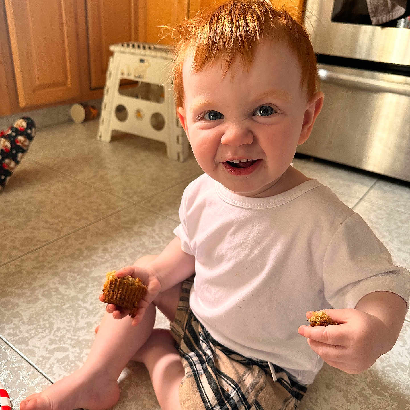 Garrett is registered to the contest to win money with this photo: baby, bodypart, clothing, cream, dessert, face, finger, food, furniture, hand, head, icecream, indoors, person, photography, portrait, shorts, sitting, sweets, t_shirt