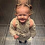 toddler, child, smiling, trench_coat, pigtails, backpack, elevator, metal_floor, reflection, portrait, happy, cute, indoor, person, fashion, young_child, small_ears, buttoned_coat, footwear, light