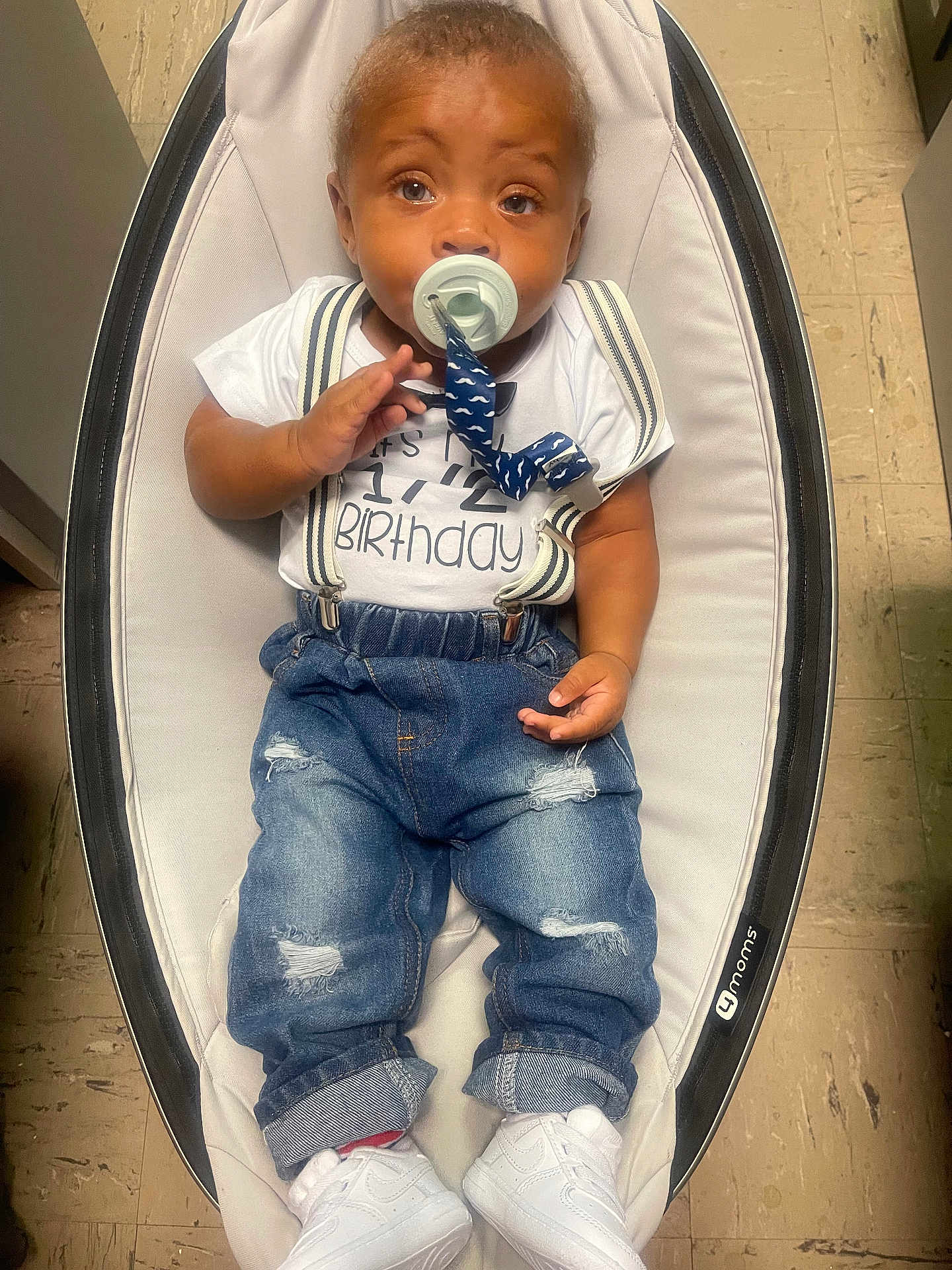 Delijah joined the competition — help win amazing prizes! baby, infant, pacifier, jeans, white_shoes, baby_rocker, half_birthday, clothing, sitting, indoor, floor, cute, child, fashion, white_shirt, denim, suspenders, footwear, baby_accessory, portrait