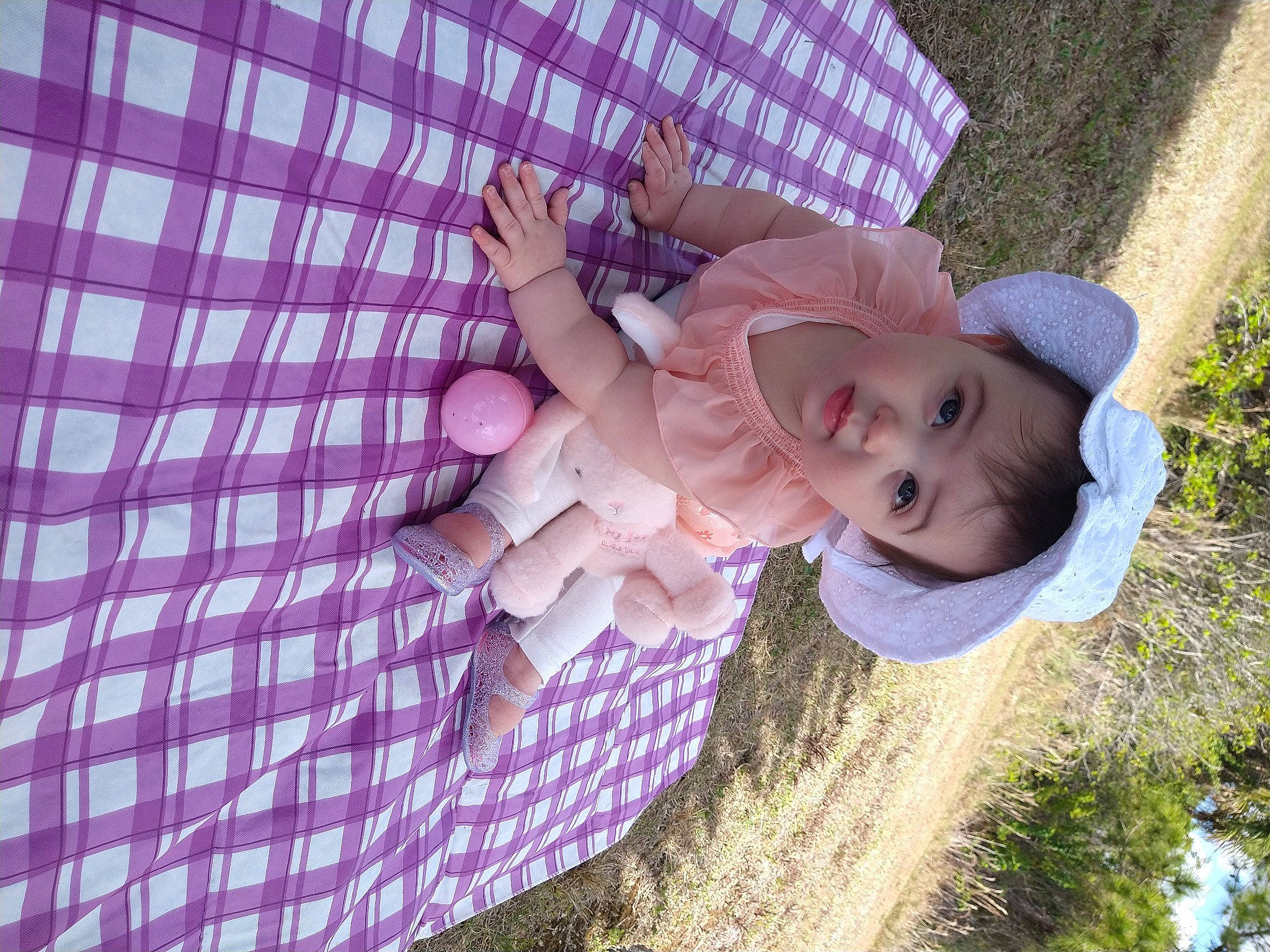 Rylee joined the competition — help win amazing prizes! baby, child, finger, fun, grass, hand, happy, hat, people_in_nature, person, pink, plant, purple, skin, smile, sun_hat, textile, thumb, toddler, violet