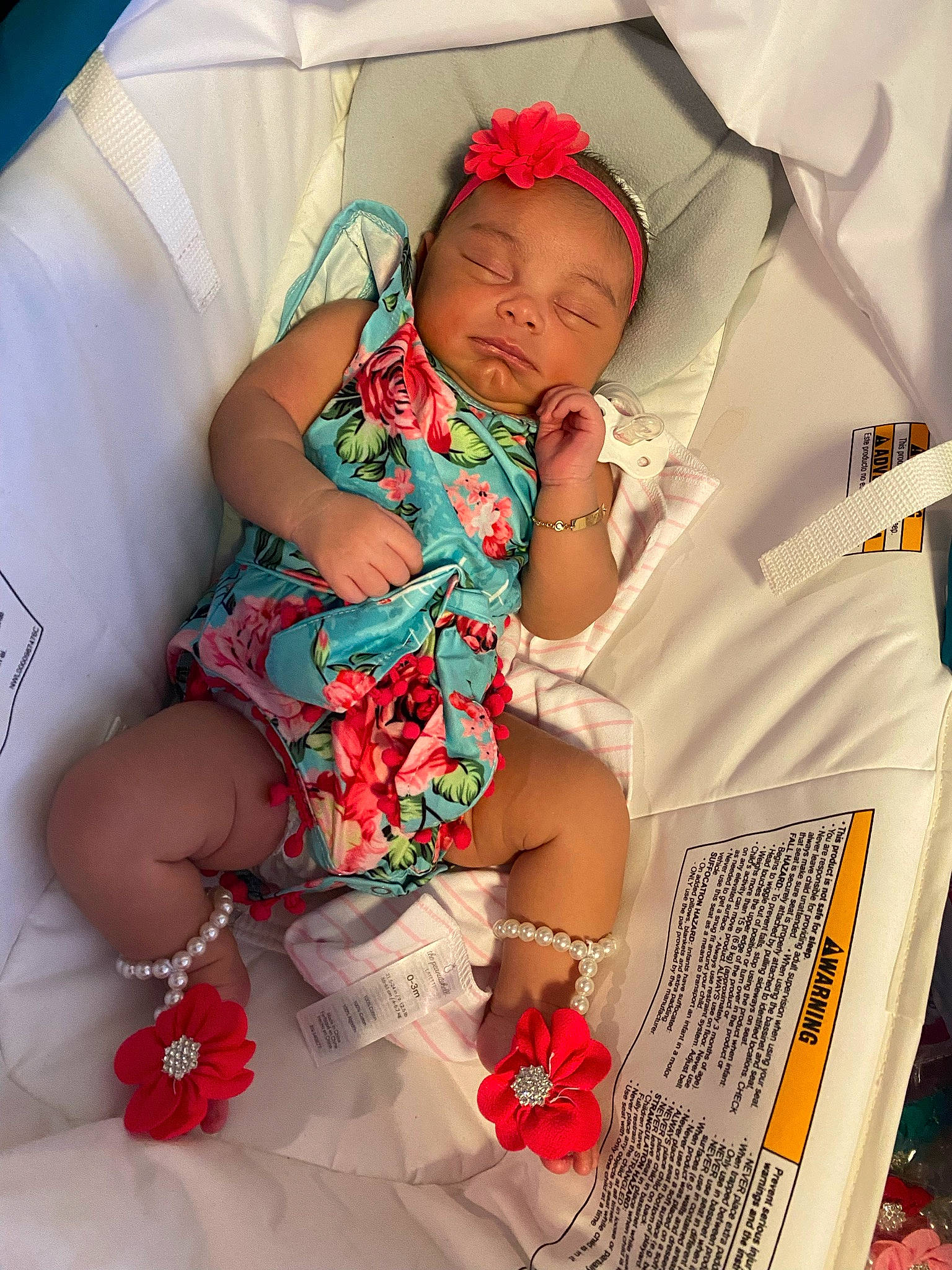 Storie is registered to the contest to win money with this photo: abdomen, baby, baby_products, baby_sleeping, baby_toddler_clothing, chest, comfort, event, happy, headwear, human_body, human_leg, leg, linens, pattern, person, pink, sitting, sleeve, thigh