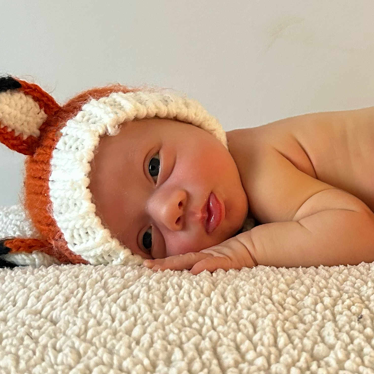 Asher is registered to the contest to win money with this photo: baby, beanie, blanket, bodypart, bonnet, cap, clothing, face, finger, glove, hand, happy, hat, head, newborn, person, photography, portrait, sleeping, smile