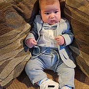 Amo is registered to the contest to win money with this photo: baby, bodypart, chair, clothing, coat, couch, cushion, face, footwear, furniture, head, homedecor, jacket, jeans, pants, person, photography, portrait, shoe, sitting