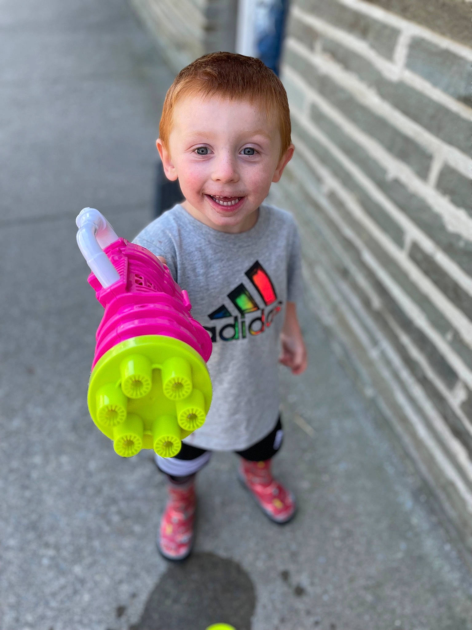 Hunter is registered to the contest to win money with this photo: baby, baby_playing_with_toys, baby_toddler_clothing, cheek, child, fun, grass, happy, head, joy, mammal, person, sitting, skin, sleeve, smile, standing, t_shirt, toddler, toy
