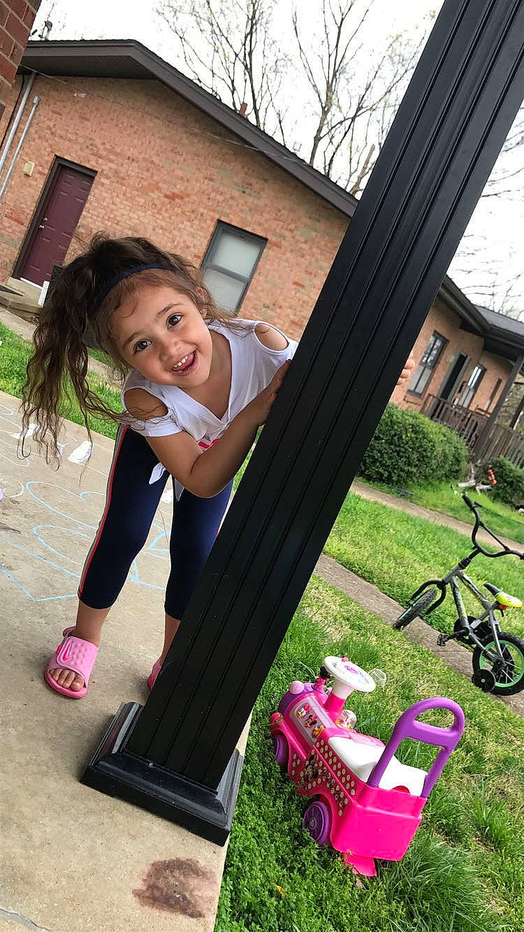 Bry'Leigh is registered to the contest to win money with this photo: automotive_wheel_system, bicycle_handlebar, bicycle_wheel, building, fun, grass, happy, house, joy, leisure, magenta, outdoor_recreation, person, pink, plant, recreation, smile, soil, tire, tree