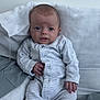 Mateo joined the competition — help win amazing prizes! baby, infant, pajamas, striped_clothing, face, hand, footed_pajamas, pillow, bedding, bed, sleepwear, person, young_child, indoors, cute, relaxed, soft_texture, expression, small_fingers, lying_down