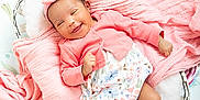 Zaria joined the competition — help win amazing prizes! baby, infant, smiling, pink_clothing, headband, basket, blanket, floral_pattern, flower_background, cute, happy, lying_down, portrait, child, soft_texture, cozy, indoors, newborn, skin, foot