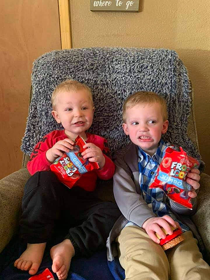 Earl Hunter is registered to the contest to win money with this photo: blue, cheek, child, comfort, couch, event, eye, face, finger, fun, hair, head, lap, leg, people, person, red, sitting, skin, smile