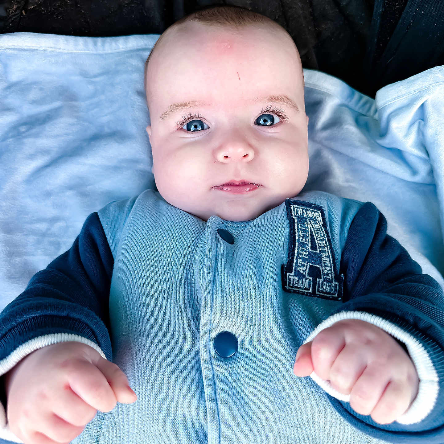 Archie is registered to the contest to win money with this photo: baby, bodypart, clothing, coat, face, finger, hand, happy, head, jacket, jeans, knitwear, longsleeve, newborn, pants, person, photography, portrait, sleeve, sweater