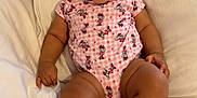 Reasiah Elohor is registered to the contest to win money with this photo: baby, bed, child, chubby, curtains, cute, face, feet, hands, happy, indoors, infant, legs, onesie, pillow, pink_clothing, sitting, skin, smiling, white_bedding