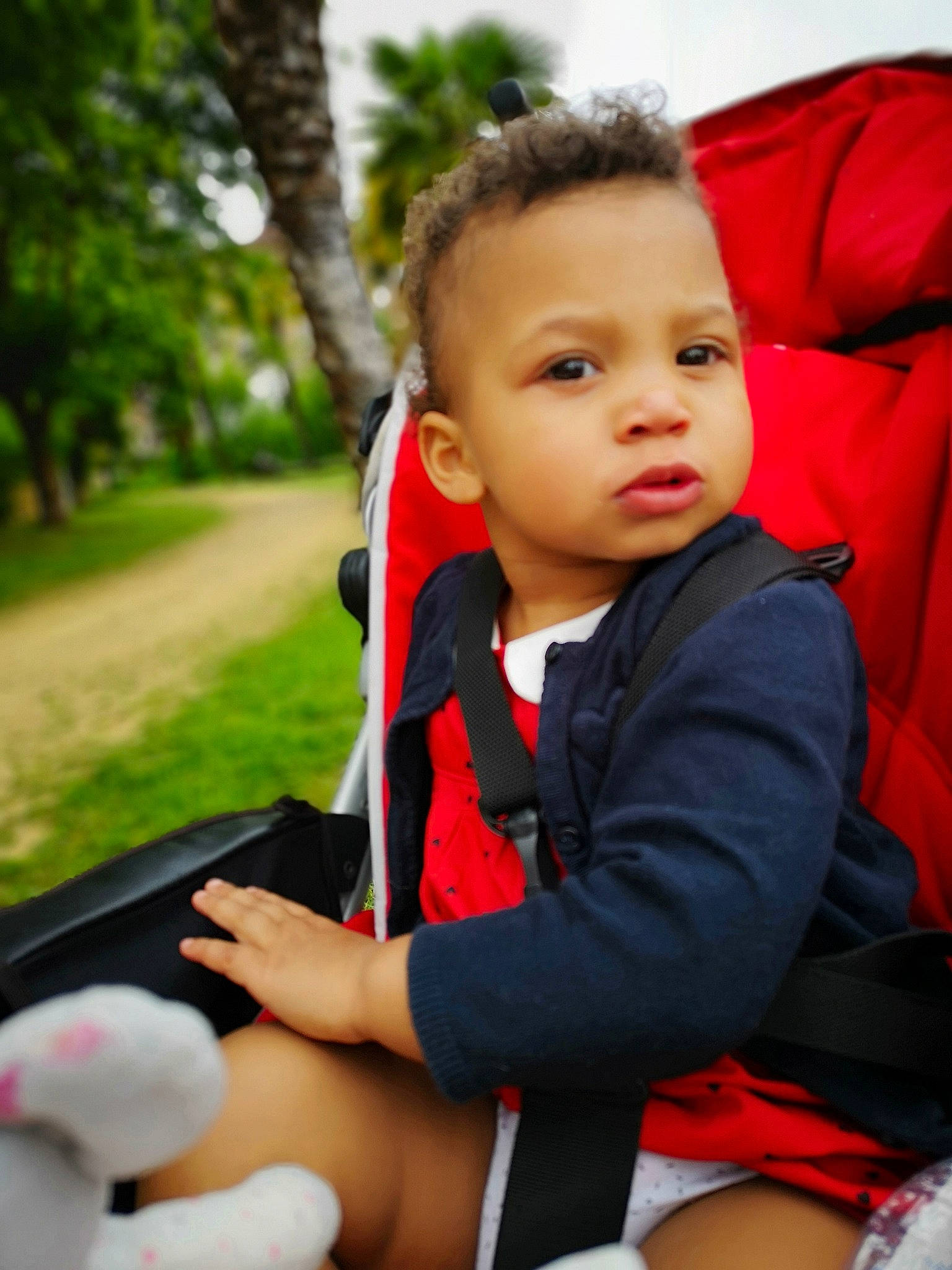 Océane participe au concours pour gagner de l'argent avec cette photo : baby, baby_carriage, baby_products, child, leisure, person, photography, play, product, red, sitting, skin, toddler, vacation